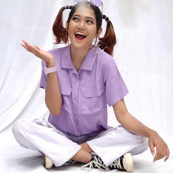 Mira Shah, Lead Design Curator at HarborQuillSerene, reviewing corporate floral arrangements